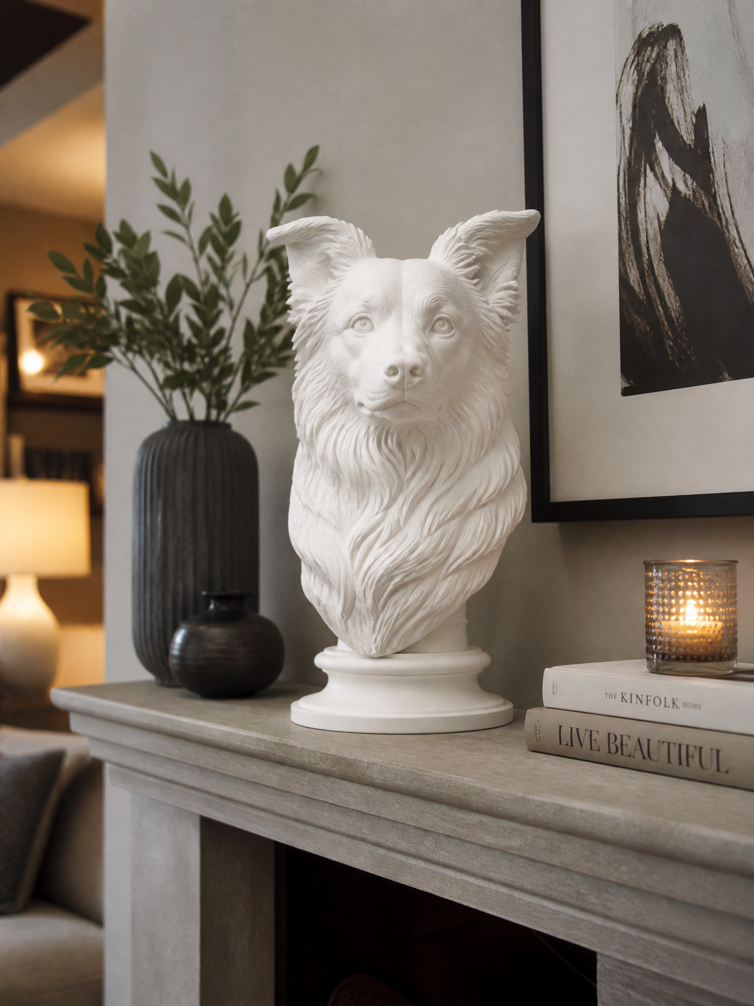 A Border Collie portrait bust in matte white on a mantelpiece